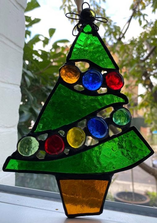 Stained glass Christmas tree with snowflakes